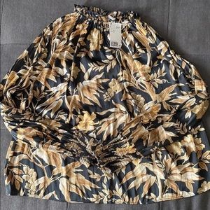 H&M black floral/leaf patterned blouse with smocked ruffle neckline.